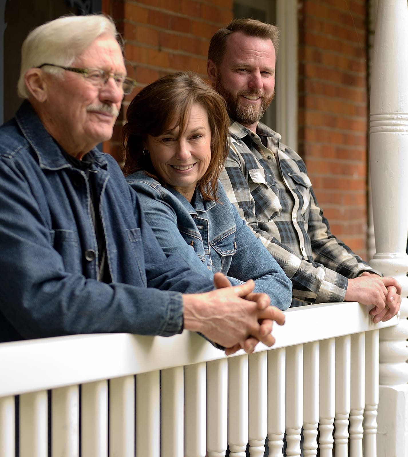 Three generations of the Greaves family on the farmhouse porch